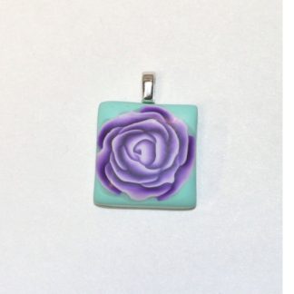 purple rose on teal tile pendant