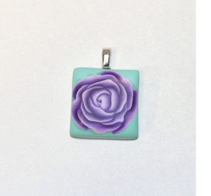 purple rose on teal tile pendant
