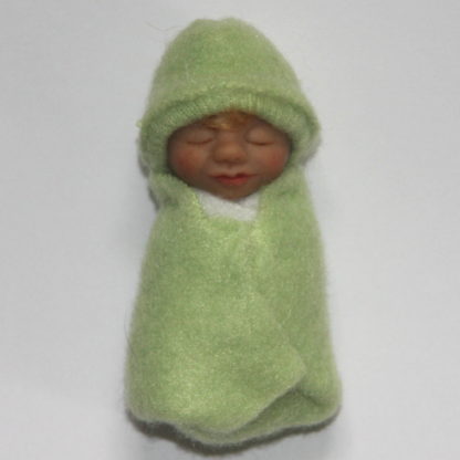 Miniature baby doll in lime green fleece