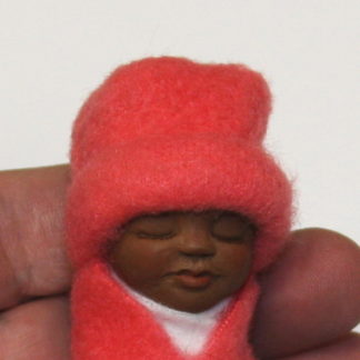 african baby doll face close up