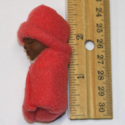 african baby in coral fleece on side