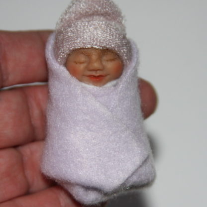 lavender baby doll in hand