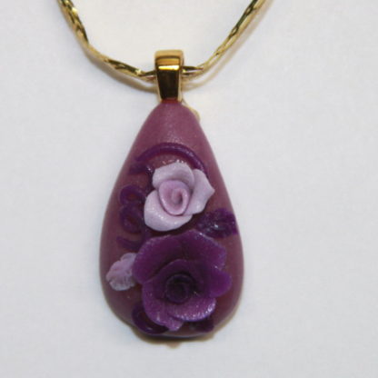 Purple and lavender Roses cabochon with gold bail
