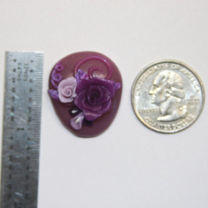 Lavender Cabochon with Purple Roses next to ruler