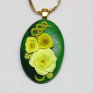 3 dimensional yellow roses on Green Polymer clay pendant Gold Bail