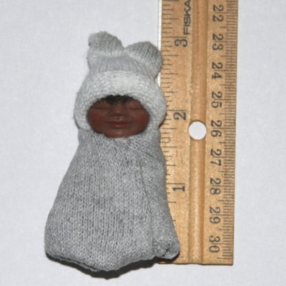 Ethnic Baby in Grey and White with ruler