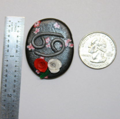 Astrology Zodiac Cancer Cabochon next to ruler