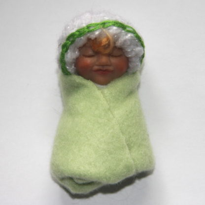 light green baby girl doll