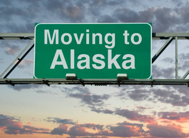 Moving to Alaska road sign